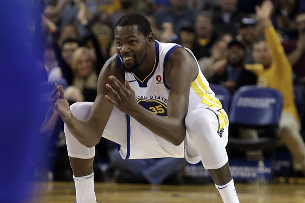 Golden State Warriors' Kevin Durant celebrates after scoring against the Orlando Magic during the second half of an NBA basketball game Monday, Nov. 13, 2017, in Oakland, Calif. The Warriors won 110-100. (AP Photo/Ben Margot)