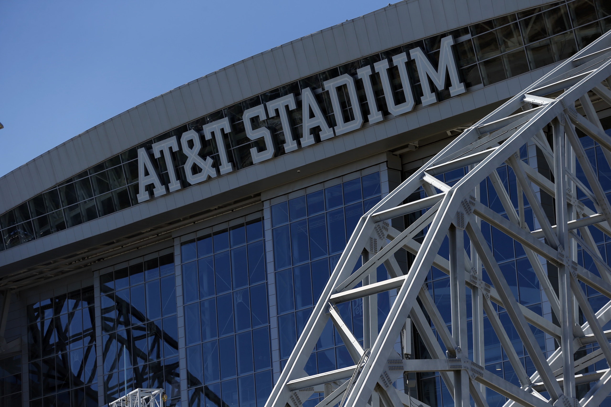 An exterior view of the AT&T logo at the top of the stadium is shown before an NFL football game between the Green Bay Packers and Dallas Cowboys on Sunday, Oct. 8, 2017, in Arlington, Texas. (AP Photo/Ron Jenkins)
