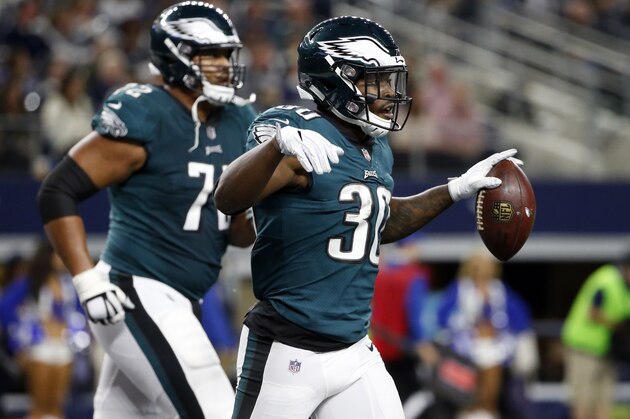 Philadelphia Eagles running back Corey Clement (30) and Halapoulivaati Vaitai (72) celebrate a two-point conversion scored by Clement in the second half of an NFL football game agains the Dallas Cowboys on Sunday, Nov. 19, 2017, in Arlington, Texas. (AP Photo/Michael Ainsworth)