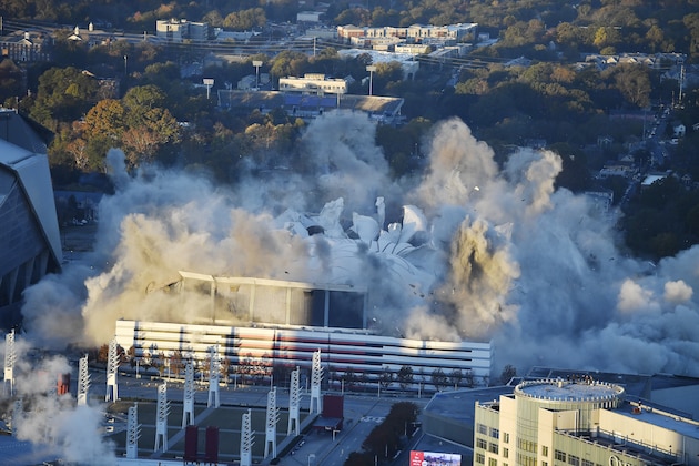 The Georgia Dome is destroyed in a scheduled implosion Monday, Nov. 20, 2017, in Atlanta. The dome was not only the former home of the Atlanta Falcons but also the site of two Super Bowls, 1996 Olympics Games events and NCAA basketball tournaments among other major events. (AP Photo/Mike Stewart)