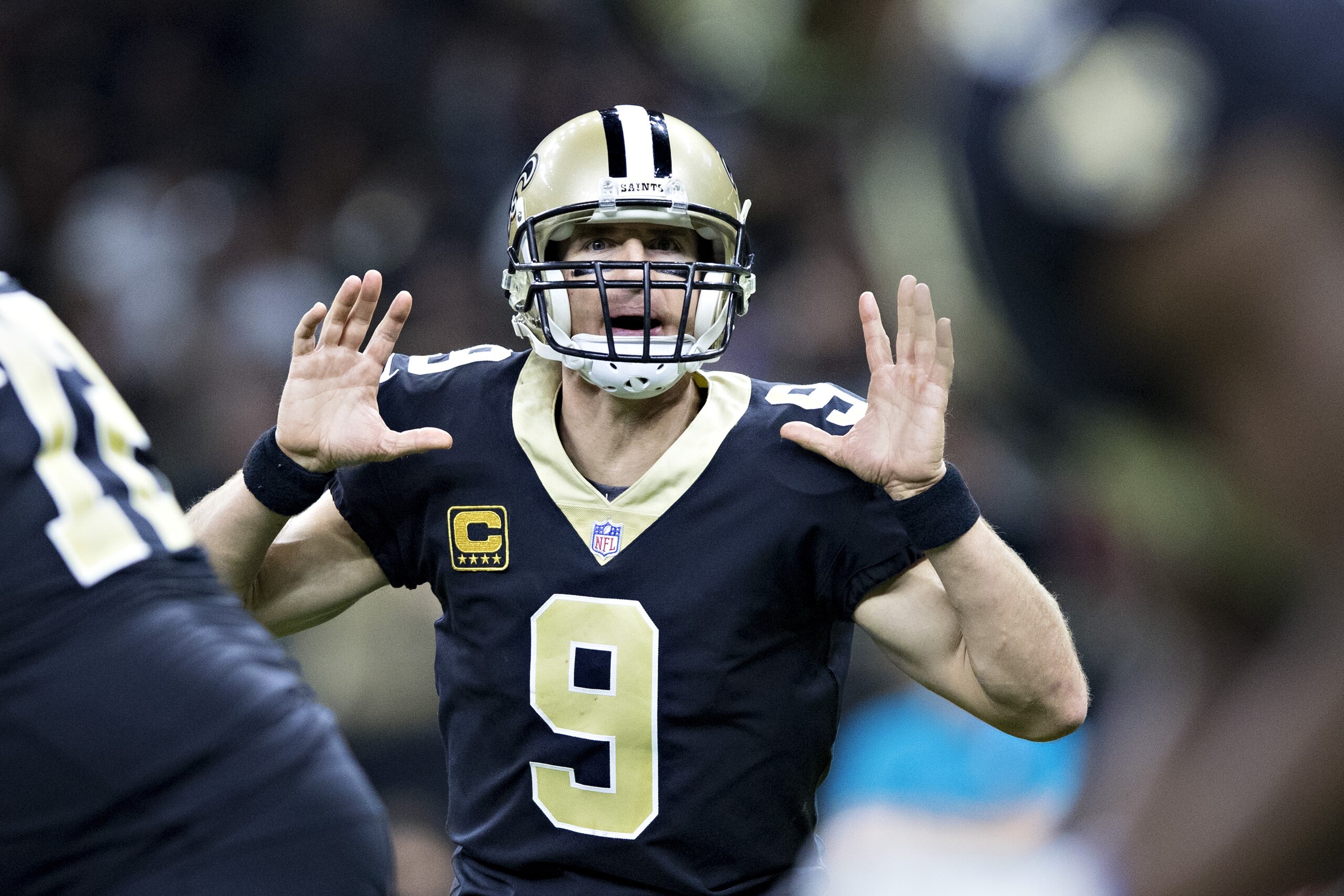 NEW ORLEANS, LA - NOVEMBER 19:  Drew Brees #9 of the New Orleans Saints calls out the play at the line of scrimmage during a game against the Washington Redskins at Mercedes-Benz Superdome on November 19, 2017 in New Orleans, Louisiana.  Saints defeated the Redskins 34-31.  (Photo by Wesley Hitt/Getty Images)