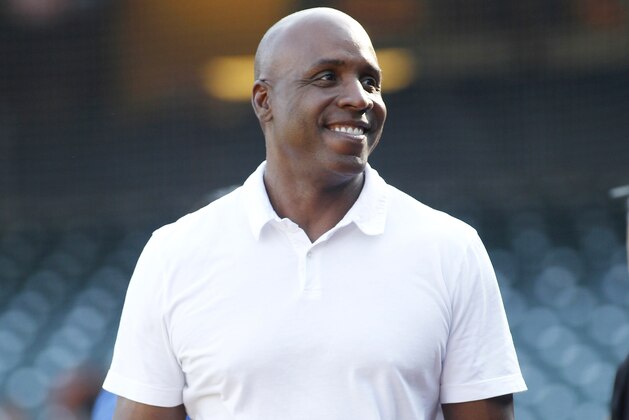 Former San Francisco Giants' Barry Bonds smiles on the field before a baseball game between the San Francisco Giants and the St. Louis Cardinals, Thursday, Aug. 31, 2017, in San Francisco. (AP Photo/George Nikitin)