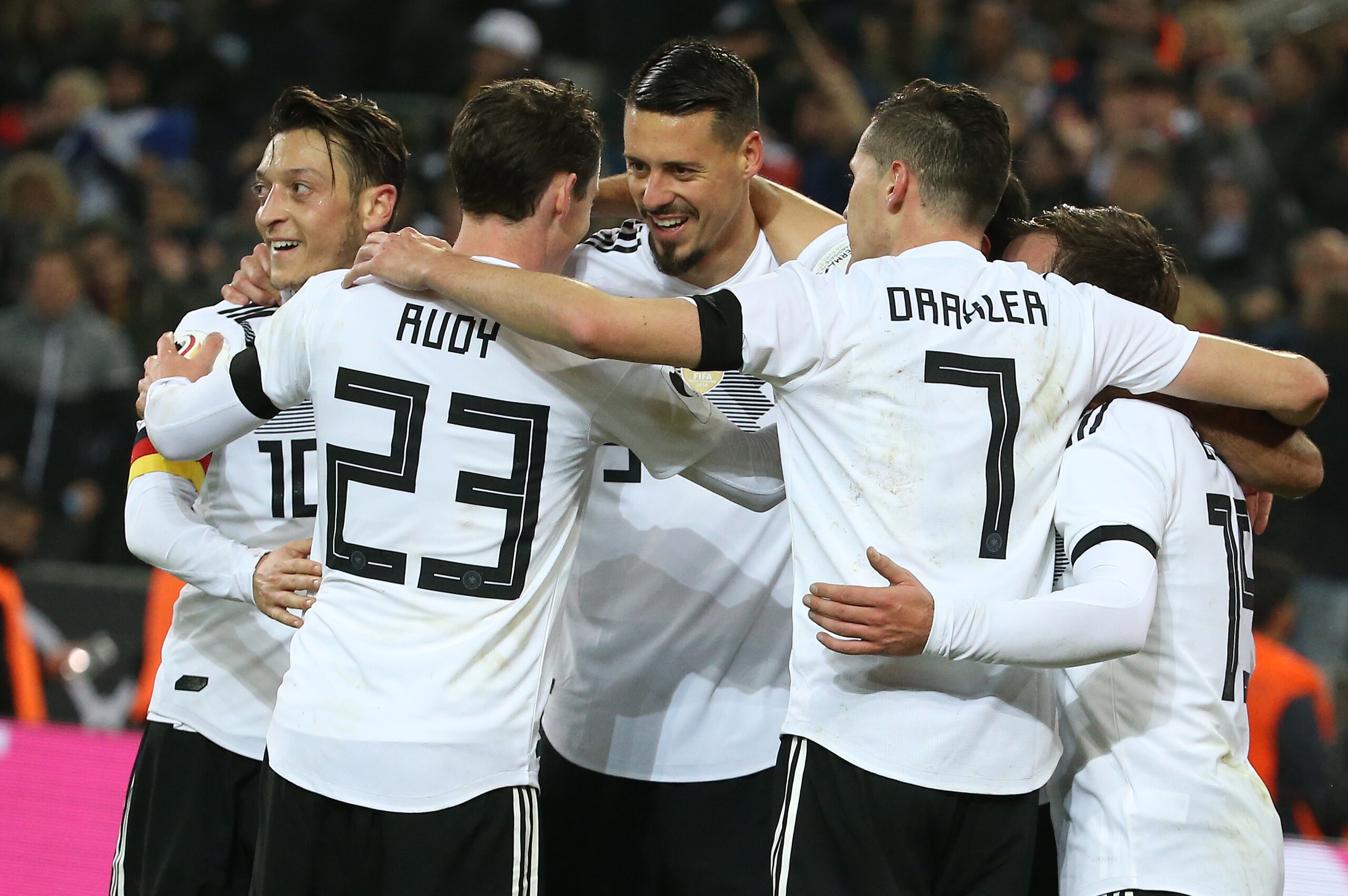 COLOGNE, GERMANY - NOVEMBER 14: Lars Stindl of Germany celebrates with Mesut Ozil, Sandro Wagner scoring the tying goal at the last minute during the international friendly match between Germany and France at RheinEnergieStadion on November 14, 2017 in Cologne, Germany. (Photo by Jean Catuffe/Getty Images)