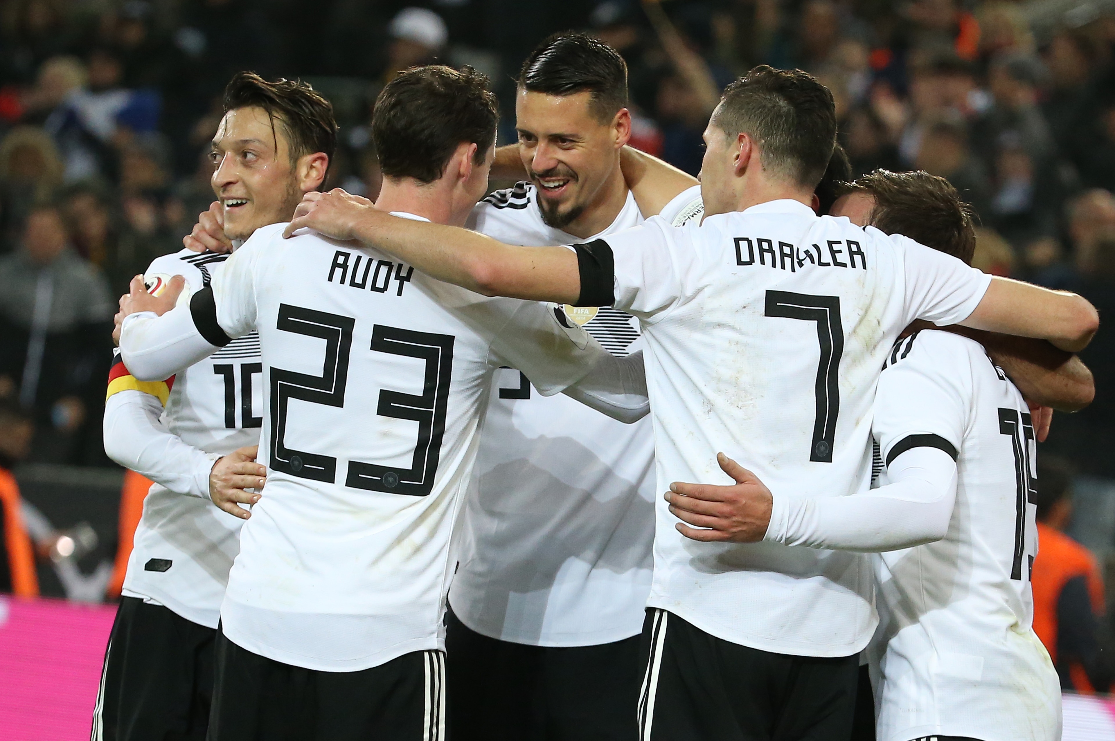 COLOGNE, GERMANY - NOVEMBER 14: Lars Stindl of Germany celebrates with Mesut Ozil, Sandro Wagner scoring the tying goal at the last minute during the international friendly match between Germany and France at RheinEnergieStadion on November 14, 2017 in Cologne, Germany. (Photo by Jean Catuffe/Getty Images)