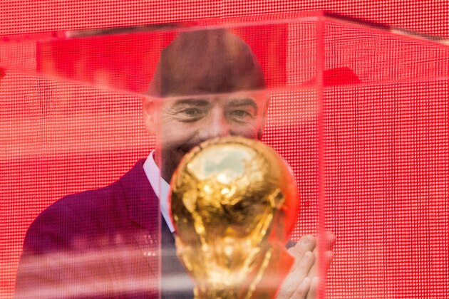 FIFA President Gianni Infantino looks at the FIFA World Cup Trophy during the  trophy tour opening ceremony at Luzhniki stadium in  Moscow on September 9, 2017. / AFP PHOTO / Mladen ANTONOV        (Photo credit should read MLADEN ANTONOV/AFP/Getty Images)