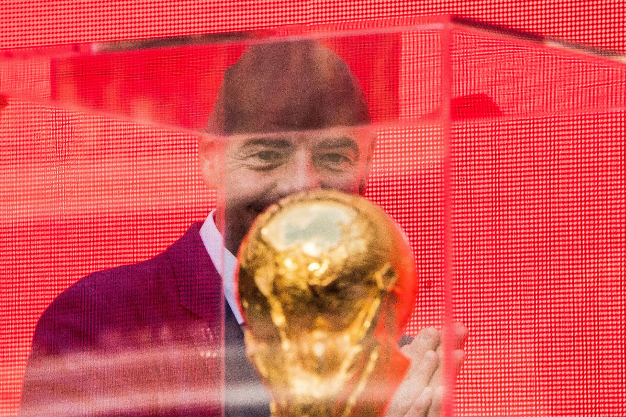 FIFA President Gianni Infantino looks at the FIFA World Cup Trophy during the  trophy tour opening ceremony at Luzhniki stadium in  Moscow on September 9, 2017. / AFP PHOTO / Mladen ANTONOV        (Photo credit should read MLADEN ANTONOV/AFP/Getty Images)