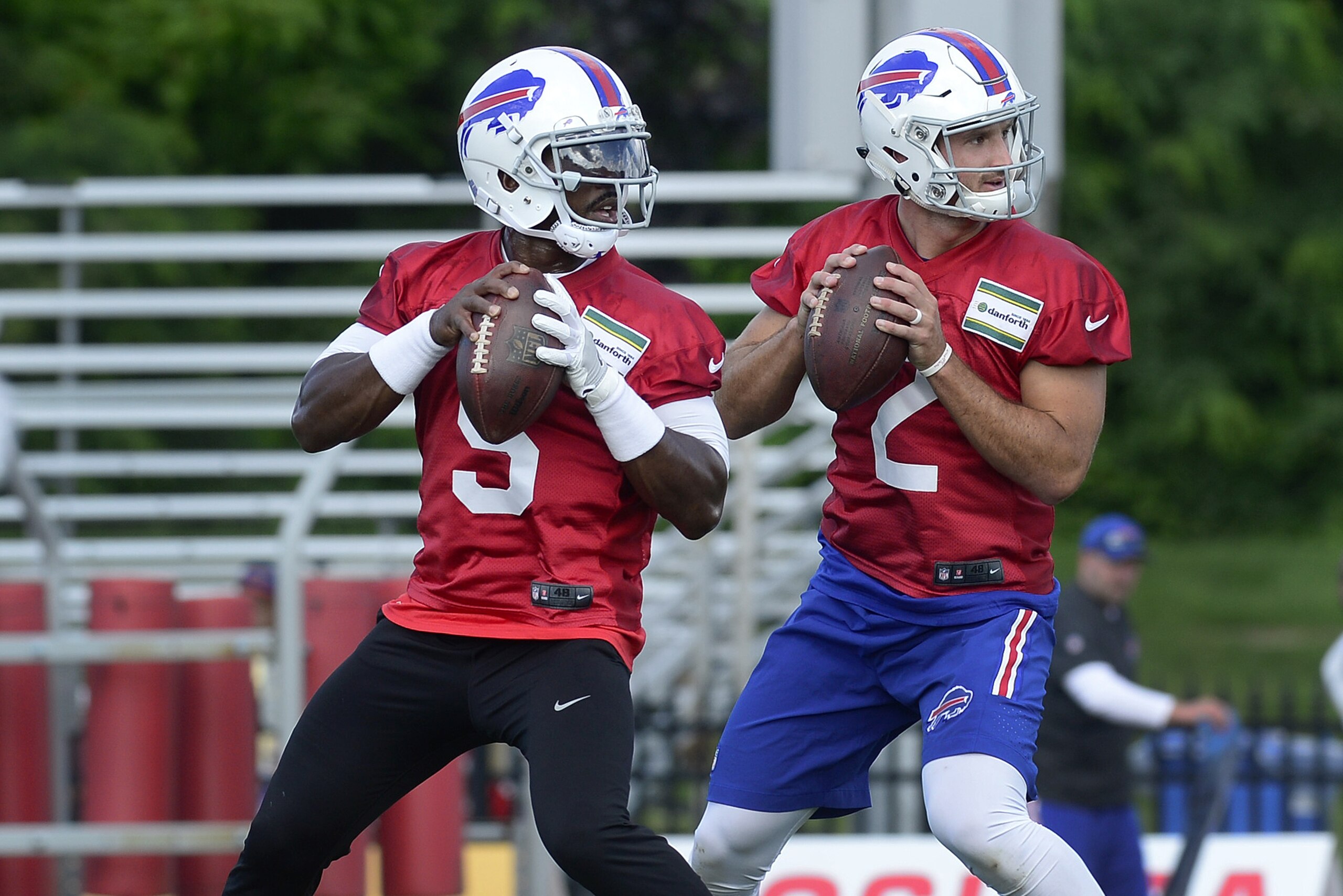 Buffalo Bills quarterback Tyrod Taylor, left, and quarterback Nathan Peterman run a drill during an NFL football training camp in Pittsford, N.Y., Thursday, July 27, 2017. (AP Photo/Adrian Kraus)