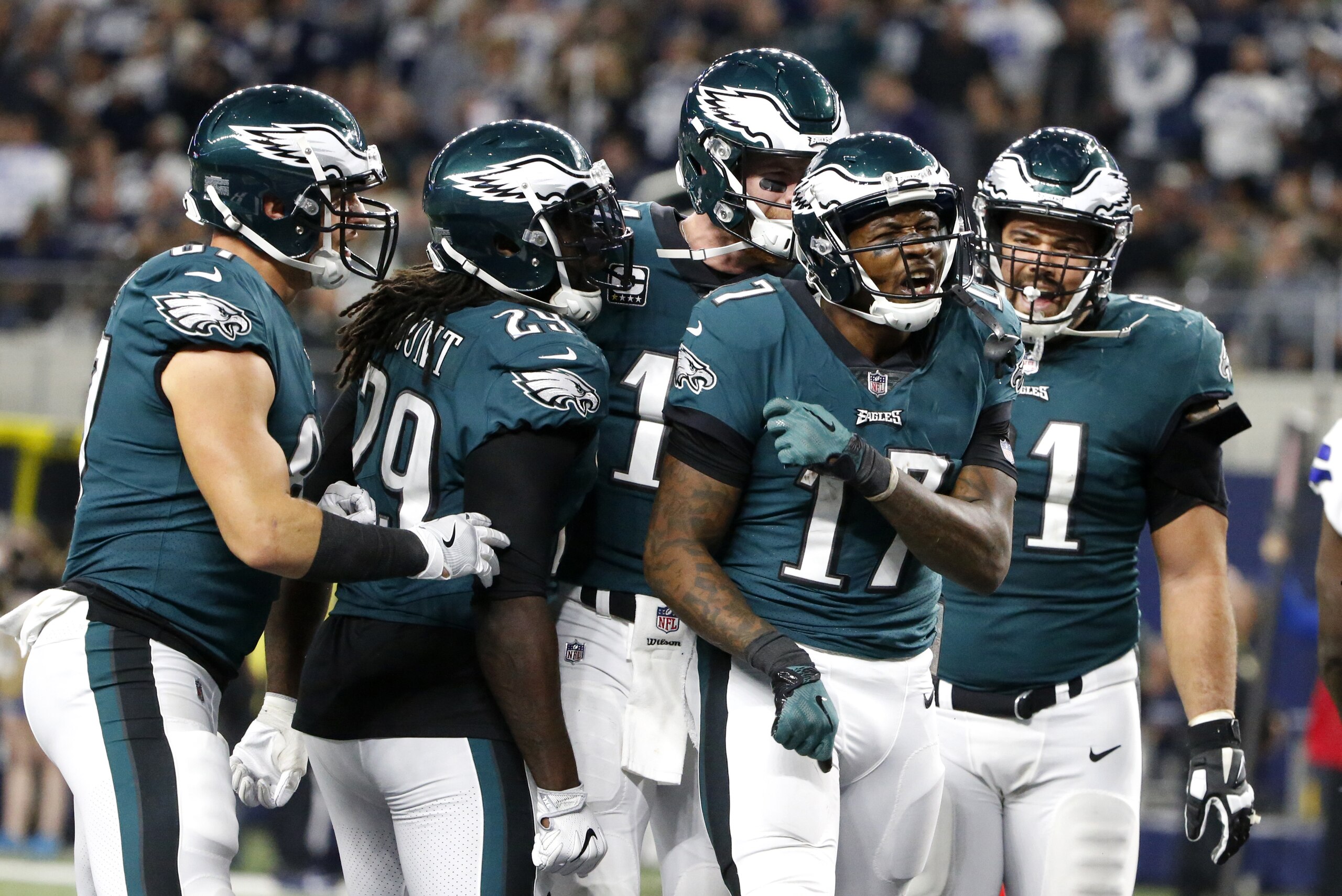 Philadelphia Eagles' Brent Celek, from left, LeGarrette Blount (29), Carson Wentz, rear, and Stefen Wisniewski, right, celebrate a touchdown catch made by Alshon Jeffery (17) in the second half of an NFL football game against the Dallas Cowboys on Sunday, Nov. 19, 2017, in Arlington, Texas. (AP Photo/Michael Ainsworth)