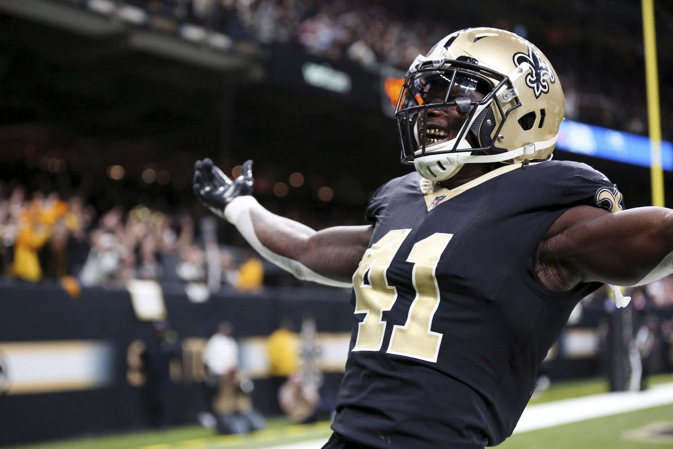 New Orleans Saints running back Alvin Kamara (41) celebrates his game-tying two-point conversion in the second half of an NFL football game against the Washington Redskins in New Orleans, Sunday, Nov. 19, 2017. The Saints won -34-31. (AP Photo/Rusty Costanza)