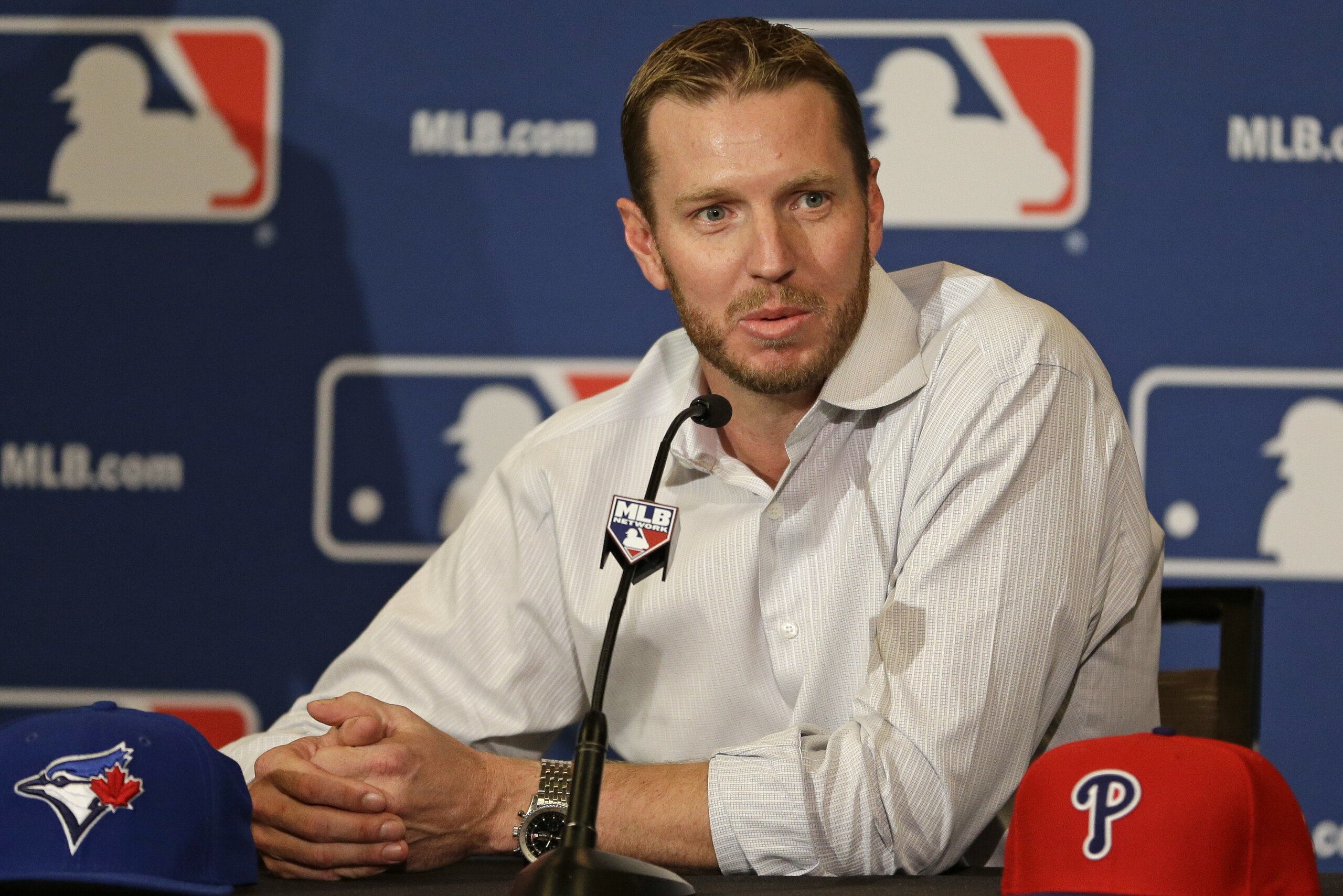FILE - In this Dec. 9, 2013, file photo, two-time Cy Young Award winner Roy Halladay answers questions after announcing his retirement after 16 seasons in the major leagues with Toronto and Philadelphia at the MLB winter meetings in Lake Buena Vista, Fla. Authorities have confirmed that former Major League Baseball pitcher Roy Halladay died in a small plane crash in the Gulf of Mexico off the coast of Florida, Tuesday, Nov. 7, 2017. (AP Photo/John Raoux, File)