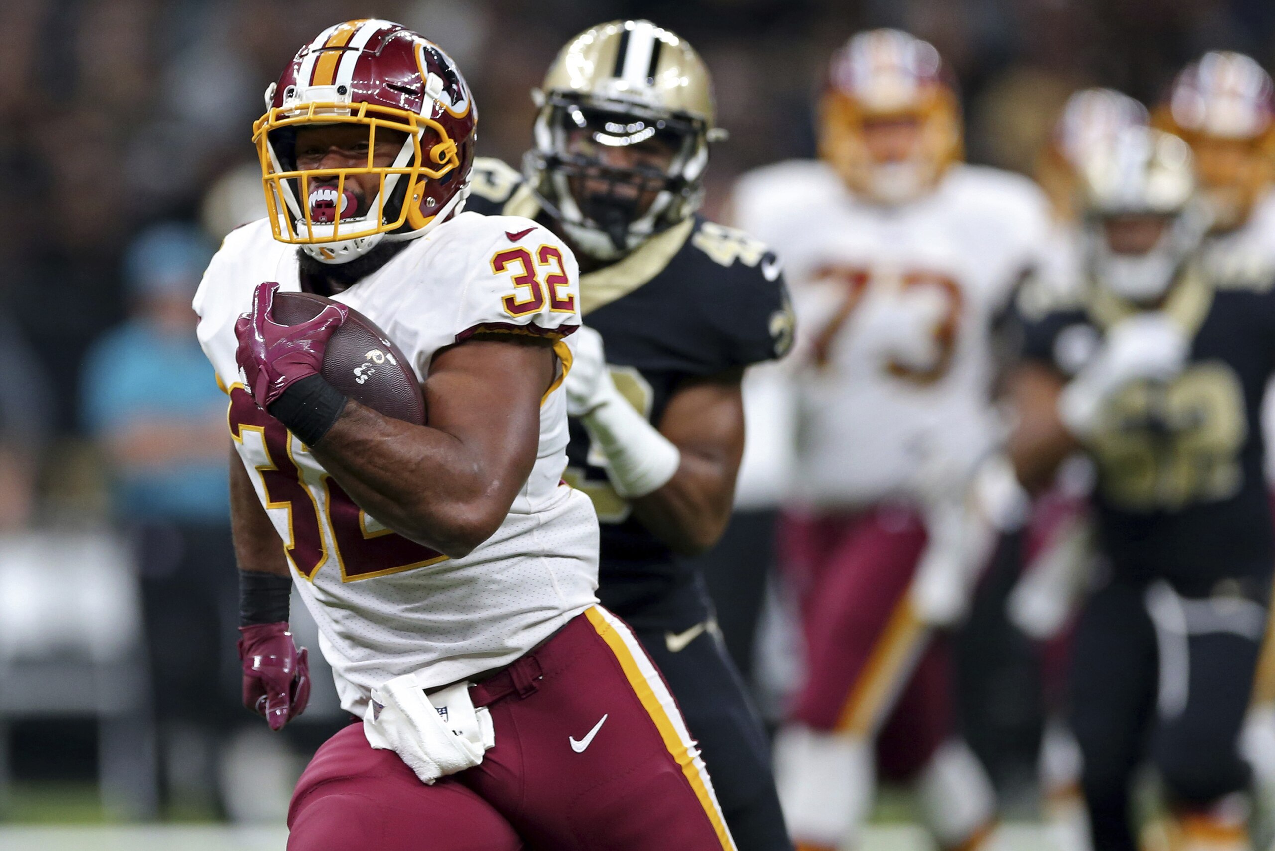 Washington Redskins running back Samaje Perine (32) carries past New Orleans Saints free safety Marcus Williams in the first half of an NFL football game in New Orleans, Sunday, Nov. 19, 2017. (AP Photo/Rusty Costanza) Washington Redskins running back Samaje Perine (32) carries past New Orleans Saints free safety Marcus Williams in the first half of an NFL football game in New Orleans, Sunday, Nov. 19, 2017. (AP Photo/Rusty Costanza)