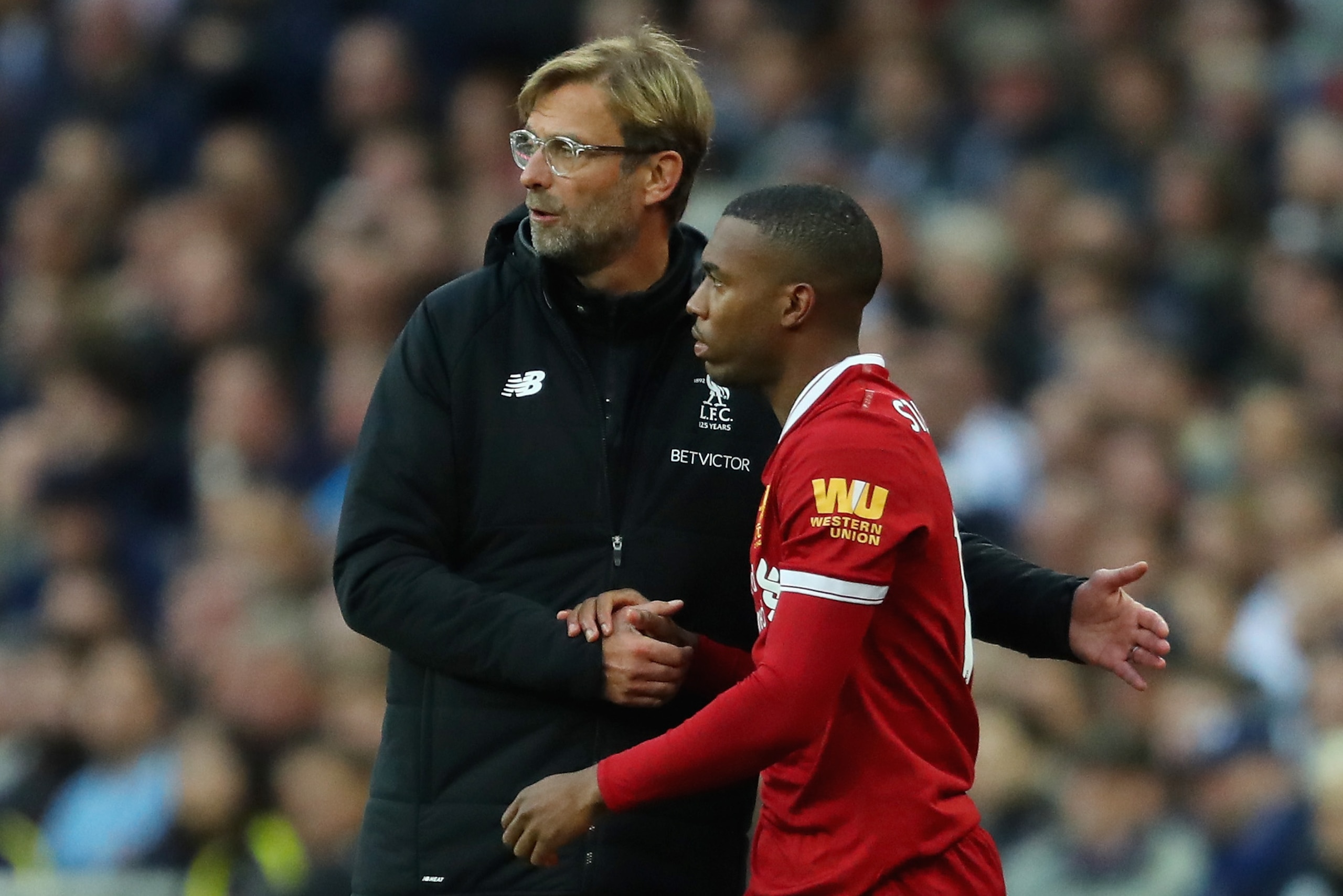 LONDON, ENGLAND - OCTOBER 22: Jurgen Klopp, Manager of Liverpool speaks to Daniel Sturridge of Liverpool as he prepares to come on during the Premier League match between Tottenham Hotspur and Liverpool at Wembley Stadium on October 22, 2017 in London, England.  (Photo by Richard Heathcote/Getty Images)