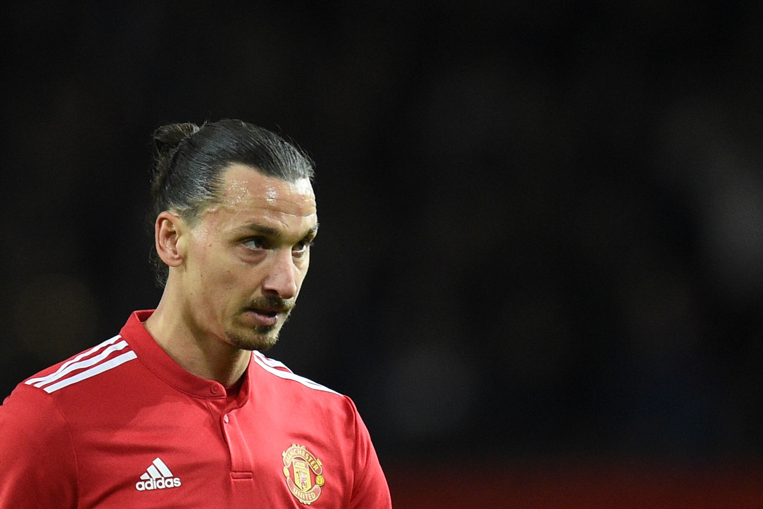 Manchester United's Swedish striker Zlatan Ibrahimovic leaves the pitch at the end of the English Premier League football match between Manchester United and Newcastle at Old Trafford in Manchester, north west England, on November 18, 2017. / AFP PHOTO / Oli SCARFF / RESTRICTED TO EDITORIAL USE. No use with unauthorized audio, video, data, fixture lists, club/league logos or 'live' services. Online in-match use limited to 75 images, no video emulation. No use in betting, games or single club/league/player publications.  /         (Photo credit should read OLI SCARFF/AFP/Getty Images)