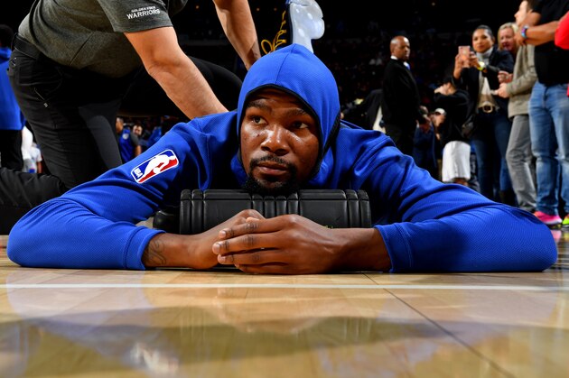 PHILADELPHIA, PA - NOVEMBER 18: Kevin Durant #35 of the Golden State Warriors stretches prior to the game against the Philadelphia 76ers on November 18, 2017 at Wells Fargo Center in Philadelphia, Pennsylvania. NOTE TO USER: User expressly acknowledges and agrees that, by downloading and/or using this Photograph, user is consenting to the terms and conditions of the Getty Images License Agreement. Mandatory Copyright Notice: Copyright 2017 NBAE (Photo by Jesse D. Garrabrant/NBAE via Getty Images) PHILADELPHIA, PA - NOVEMBER 18: Kevin Durant #35 of the Golden State Warriors stretches prior to the game against the Philadelphia 76ers on November 18, 2017 at Wells Fargo Center in Philadelphia, Pennsylvania. NOTE TO USER: User expressly acknowledges and agrees that, by downloading and/or using this Photograph, user is consenting to the terms and conditions of the Getty Images License Agreement. Mandatory Copyright Notice: Copyright 2017 NBAE (Photo by Jesse D. Garrabrant/NBAE via Getty Images)