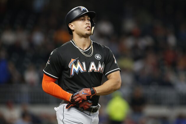 Miami Marlins' Giancarlo Stanton walks in the seventh inning of a baseball game against the Atlanta Braves, Thursday, Sept. 7, 2017, in Atlanta. (AP Photo/Brett Davis)