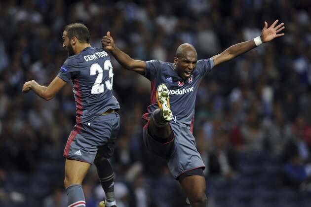 Besiktas' Ryan Babel, right, celebrates with teammate Cenk Tosun after scoring his side's third goal during the Champions League group G soccer match between FC Porto and Besiktas at the Dragao stadium in Porto, Portugal, Wednesday, Sept. 13, 2017. (AP Photo/Paulo Duarte)