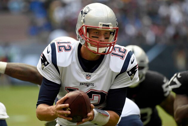 Tom Brady of New England Patriots controls the ball during the 2016 NFL week 11 regular season football game against Oakland Raiders on November 19, 2017 at the Azteca Stadium in Mexico City. / AFP PHOTO / ALFREDO ESTRELLA        (Photo credit should read ALFREDO ESTRELLA/AFP/Getty Images)