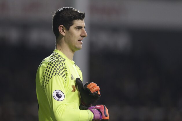 Chelsea goalkeeper Thibaut Courtois  pulls on his gloves during the English Premier League soccer match between Tottenham Hotspur and Chelsea at White Hart Lane stadium in London, Wednesday, Jan.  7,  2017. (AP Photo/Alastair Grant)