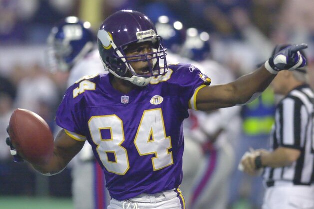 Minnesota Vikings wide receiver Randy Moss points to fans as he celebrates his first quarter touchdown against the New York Giants in Minneapolis, Monday, Nov. 19, 2001. Moss scored three touchdowns as the Vikings beat the Giants 28-16. (AP Photo/Ann Heisenfelt)