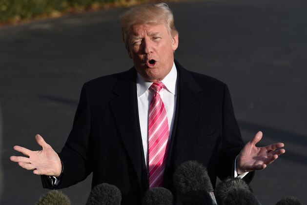 US President Donald Trump speaks to the press before departing from the south lawn of the White House in Washington, DC on November 21, 2017. / AFP PHOTO / ANDREW CABALLERO-REYNOLDS        (Photo credit should read ANDREW CABALLERO-REYNOLDS/AFP/Getty Images)