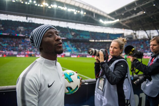 Leipzig´s Guinean midfielder Naby Deco Keita leaves the field after the warm up prior to the German first division Bundesliga football match between RB Leipzig and Hannover 96 in Leipzig, eastern Germany on November 3, 2017.  / AFP PHOTO / ROBERT MICHAEL / RESTRICTIONS: DURING MATCH TIME: DFL RULES TO LIMIT THE ONLINE USAGE TO 15 PICTURES PER MATCH AND FORBID IMAGE SEQUENCES TO SIMULATE VIDEO. == RESTRICTED TO EDITORIAL USE == FOR FURTHER QUERIES PLEASE CONTACT DFL DIRECTLY AT + 49 69 650050
        (Photo credit should read ROBERT MICHAEL/AFP/Getty Images)