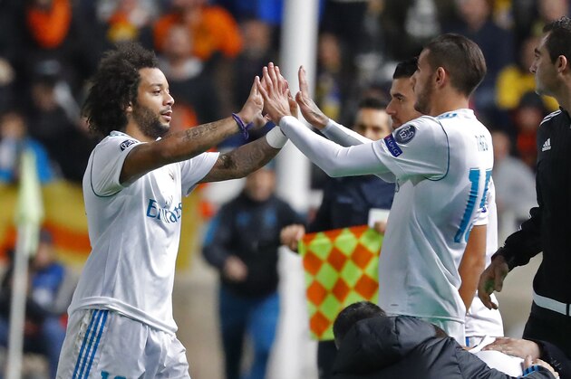 Real Madrid's Brazillian defender Marcelo celebrates with Real Madrid's French defender Theo Hernandez during the UEFA Champions League Group H match between Apoel FC and Real Madrid on November 21, 2017, in the Cypriot capital Nicosia's GSP Stadium.  / AFP PHOTO / Jack GUEZ        (Photo credit should read JACK GUEZ/AFP/Getty Images)
