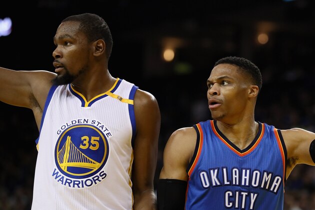 OAKLAND, CA - JANUARY 18:  Kevin Durant #35 of the Golden State Warriors and Russell Westbrook #0 of the Oklahoma City Thunder point in different directions after the ball went out of bounds at ORACLE Arena on January 18, 2017 in Oakland, California.  NOTE TO USER: User expressly acknowledges and agrees that, by downloading and or using this photograph, User is consenting to the terms and conditions of the Getty Images License Agreement.  (Photo by Ezra Shaw/Getty Images)