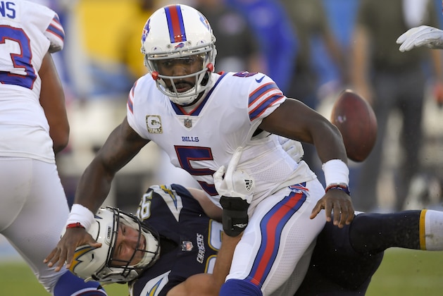 Los Angeles Chargers defensive end Joey Bosa, right, forces a turn over by Buffalo Bills quarterback Tyrod Taylor during the second half of an NFL football game Sunday, Nov. 19, 2017, in Carson, Calif. (AP Photo/Mark J. Terrill)