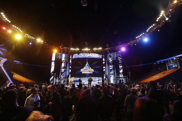 People gather ringside as they listen to professional wrestler Ryan Reeves, known as Ryback, at the Wrestlemania Axxess event Saturday, April 6, 2013, in East Rutherford, N.J., ahead of Sunday's WWE Wrestlemania 29 at MetLife stadium. (AP Photo/Mel Evans)
