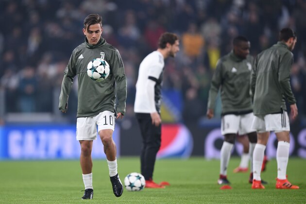 Juventus' forward from Argentina Paulo Dybala warms up before the UEFA Champions League Group D football match Juventus Barcelona on November 22, 2017 at the Juventus stadium in Turin.  / AFP PHOTO / Filippo MONTEFORTE / The erroneous mention[s] appearing in the metadata of this photo by Filippo Monteforte has been modified in AFP systems in the following manner: [during the UEFA Champions League football match Juventus vs Barcelona on November 22, 2017 at the Juventus stadium in Turin] . Please immediately remove the erroneous mention[s] from all your online services and delete it (them) from your servers. If you have been authorized by AFP to distribute it (them) to third parties, please ensure that the same actions are carried out by them. Failure to promptly comply with these instructions will entail liability on your part for any continued or post notification usage. Therefore we thank you very much for all your attention and prompt action. We are sorry for the inconvenience this notification may cause a
