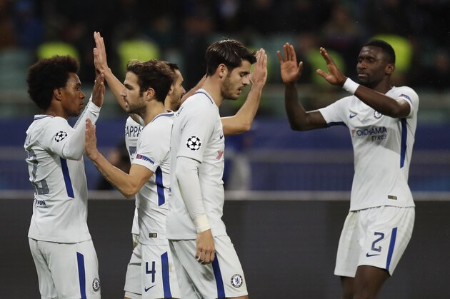 Chelsea's Willian, left, celebrates with his teammates after scoring his sides fourth goal of the game during their Champions League, group C, soccer match between Qarabag FK and Chelsea at the Baku Olympic stadium in Baku, Azerbaijan, Wednesday, Nov. 22, 2017. Chelsea won the game 4-0. (AP Photo/Pavel Golovkin)