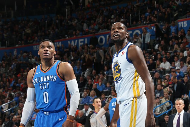 OKLAHOMA CITY, OK - NOVEMBER 22: Kevin Durant #35 of the Golden State Warriors and Russell Westbrook #0 of the Oklahoma City Thunder looks on on November 22, 2017 at Chesapeake Energy Arena in Oklahoma City, Oklahoma. NOTE TO USER: User expressly acknowledges and agrees that, by downloading and or using this photograph, User is consenting to the terms and conditions of the Getty Images License Agreement. Mandatory Copyright Notice: Copyright 2017 NBAE (Photo by Layne Murdoch/NBAE via Getty Images)