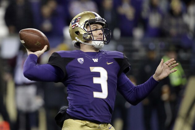 Washington quarterback Jake Browning drops back to pass against Utah during the first half of an NCAA college football game Saturday, Nov. 18, 2017, in Seattle. (AP Photo/Elaine Thompson)