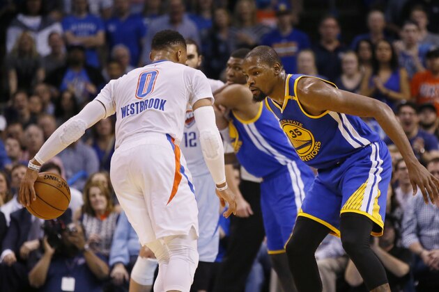 FILE - In this Feb. 11, 2017, file photo, Golden State Warriors forward Kevin Durant (35) defends as Oklahoma City Thunder guard Russell Westbrook (0) dribbles during an NBA basketball game in Oklahoma City. Westbrook and Durant were teammates for years, now are rivals, and are set to be teammates again for the Western Conference at the NBA All-Star Game in New Orleans this weekend. (AP Photo/Sue Ogrocki, File)
