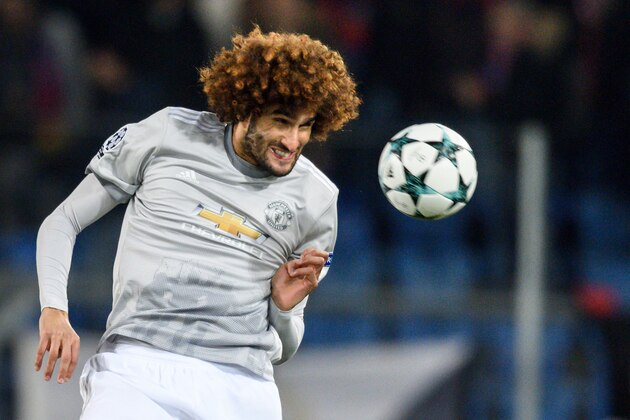 Manchester United's Belgian midfielder Marouane Fellaini heads the ball during the UEFA Champions League Group A football match between FC Basel and Manchester United on November 22, 2017 in Basel. / AFP PHOTO / Fabrice COFFRINI        (Photo credit should read FABRICE COFFRINI/AFP/Getty Images)
