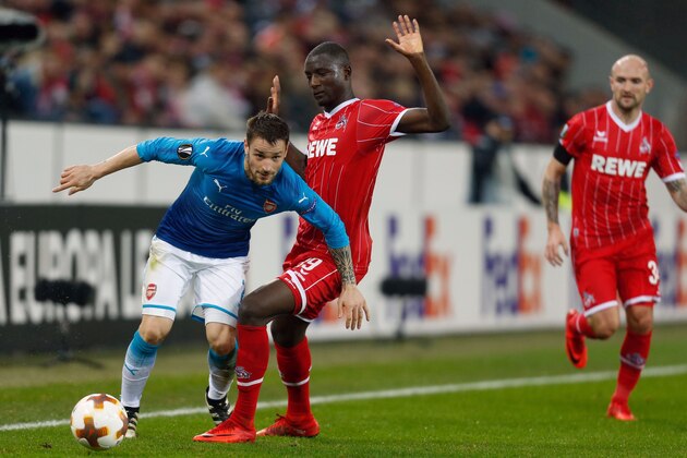 Cologne's French forward Sehrou Guirassy and Arsenal's French defender Mathieu Debuchy (L) vie for the ball during the UEFA Europa League football match 1 FC Cologne v Arsenal FC on November 23, 2017 in Cologne, western Germany. / AFP PHOTO / Ina FASSBENDER        (Photo credit should read INA FASSBENDER/AFP/Getty Images)