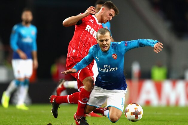 COLOGNE, GERMANY - NOVEMBER 23:  Jorge Mere of FC Koeln tackles Jack Wilshere of Arsenal during the UEFA Europa League group H match between 1. FC Koeln and Arsenal FC at RheinEnergieStadion on November 23, 2017 in Cologne, Germany.  (Photo by Dean Mouhtaropoulos/Getty Images)