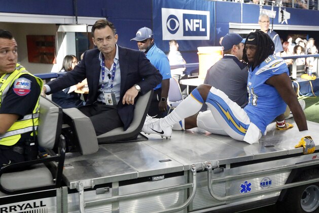 Los Angeles Chargers wide receiver Mike Williams (81) is carted off the field by team staff and an emergency responder in the first half of an NFL football game, Thursday, Nov. 23, 2017, in Arlington, Texas. (AP Photo/Michael Ainsworth)