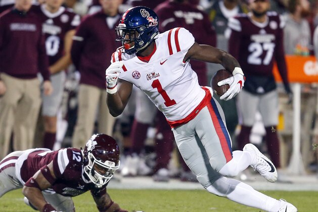 STARKVILLE, MS - NOVEMBER 23:  A.J. Brown #1 of the Mississippi Rebels catches a pass as J.T. Gray #12 of the Mississippi State Bulldogs defends during the first half of an NCAA football game at Davis Wade Stadium on November 23, 2017 in Starkville, Mississippi. (Photo by Butch Dill/Getty Images)
