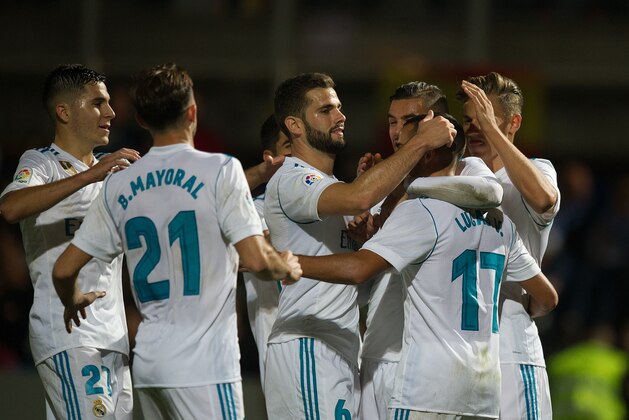 MADRID, SPAIN - OCTOBER 26: Lucas Vazquez (#17) of Real Madrid CF celebrates with teammates after scoring his teamÕs 2nd goal from a penalty kick during the Copa del Rey, Round of 32, First Leg match between Fuenlabrada and Real Madrid at Estadio Fernando Torres on October 26, 2017 in Madrid, Spain. (Photo by Denis Doyle/Getty Images)