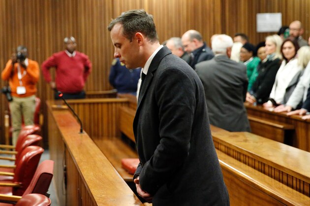 South African Paralympian athlete Oscar Pistorius (C) reacts at the High Court in Pretoria, on July 6, 2016 after being sentenced to six years in jail for murdering his girlfriend Reeva Steenkamp three years ago.
Pistorius was freed from prison in the South African capital Pretoria last October after serving one year of a five-year term for culpable homicide -- the equivalent of manslaughter. / AFP / POOL / MARCO LONGARI        (Photo credit should read MARCO LONGARI/AFP/Getty Images)