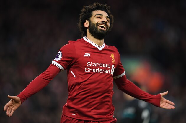 Liverpool's Egyptian midfielder Mohamed Salah celebrates scoring his team's second goal during the English Premier League football match between Liverpool and Southampton at Anfield in Liverpool, north west England on November 18, 2017. / AFP PHOTO / Paul ELLIS / RESTRICTED TO EDITORIAL USE. No use with unauthorized audio, video, data, fixture lists, club/league logos or 'live' services. Online in-match use limited to 75 images, no video emulation. No use in betting, games or single club/league/player publications.  /         (Photo credit should read PAUL ELLIS/AFP/Getty Images)
