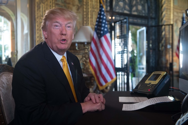 US President Donald Trump prepares his traditionnal adress to thank members of the US military via video teleconference on Thanksgiving day, November 23, 2017 from his residence in Mar-a-Lago in Florida.
 
The US President is spending the Thanksgiving holidays in his Florida private residence until November 26.  / AFP PHOTO / Nicholas KAMM        (Photo credit should read NICHOLAS KAMM/AFP/Getty Images)