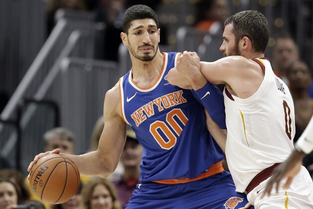 New York Knicks' Enes Kanter, left, drives past Cleveland Cavaliers' Kevin Love in the first half of an NBA basketball game, Sunday, Oct. 29, 2017, in Cleveland. (AP Photo/Tony Dejak) New York Knicks' Enes Kanter, left, drives past Cleveland Cavaliers' Kevin Love in the first half of an NBA basketball game, Sunday, Oct. 29, 2017, in Cleveland. (AP Photo/Tony Dejak)