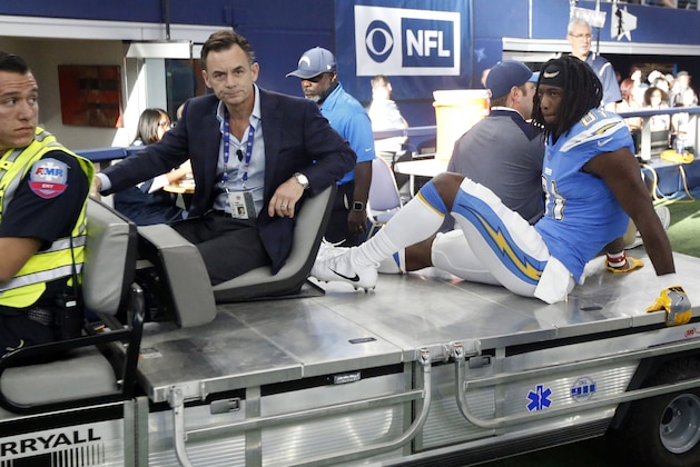 Los Angeles Chargers wide receiver Mike Williams (81) is carted off the field by team staff and an emergency responder in the first half of an NFL football game, Thursday, Nov. 23, 2017, in Arlington, Texas. (AP Photo/Michael Ainsworth)