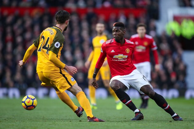 MANCHESTER, ENGLAND - NOVEMBER 25: Davy Propper of Brighton & Hove Albion and Paul Pogba of Manchester United during the Premier League match between Manchester United and Brighton and Hove Albion at Old Trafford on November 25, 2017 in Manchester, England. (Photo by Robbie Jay Barratt - AMA/Getty Images)
