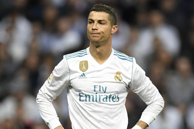 Real Madrid's Portuguese forward Cristiano Ronaldo looks on during the Spanish league football match Real Madrid CF against Malaga CF on 25, November 2017 at the Santiago Bernabeu stadium in Madrid. / AFP PHOTO / GABRIEL BOUYS        (Photo credit should read GABRIEL BOUYS/AFP/Getty Images)