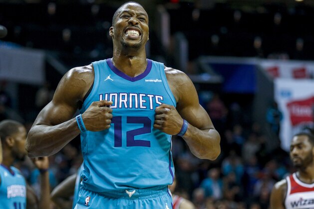 Charlotte Hornets center Dwight Howard reacts as the Hornets play the Washington Wizards in the second half of an NBA basketball game in Charlotte, N.C., Wednesday, Nov. 22, 2017. Charlotte won 129-124 in overtime. (AP Photo/Nell Redmond)