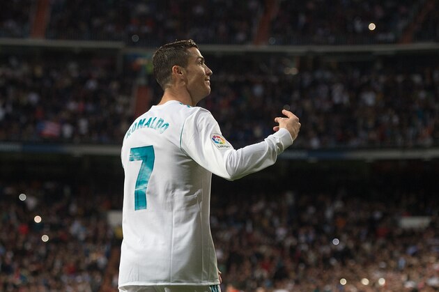 MADRID, SPAIN - NOVEMBER 25: Cristiano Ronaldo of Real Madrid CF celebrates after scoring his team's 3rd goal from a penalty rebound during the La Liga match between Real Madrid and Malaga at Estadio Santiago Bernabeu on November 25, 2017 in Madrid, Spain. (Photo by Denis Doyle/Getty Images)