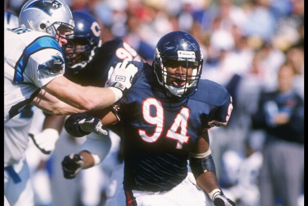8 Oct 1995:  Defensive end John Thierry of the Chicago Bears tries to break throught the offensive line during a game against the Carolina Panthers at Soldier Field in Chicago, Illinois.  The Bears won the game 31-27. Mandatory Credit: Jonathan Daniel  /A